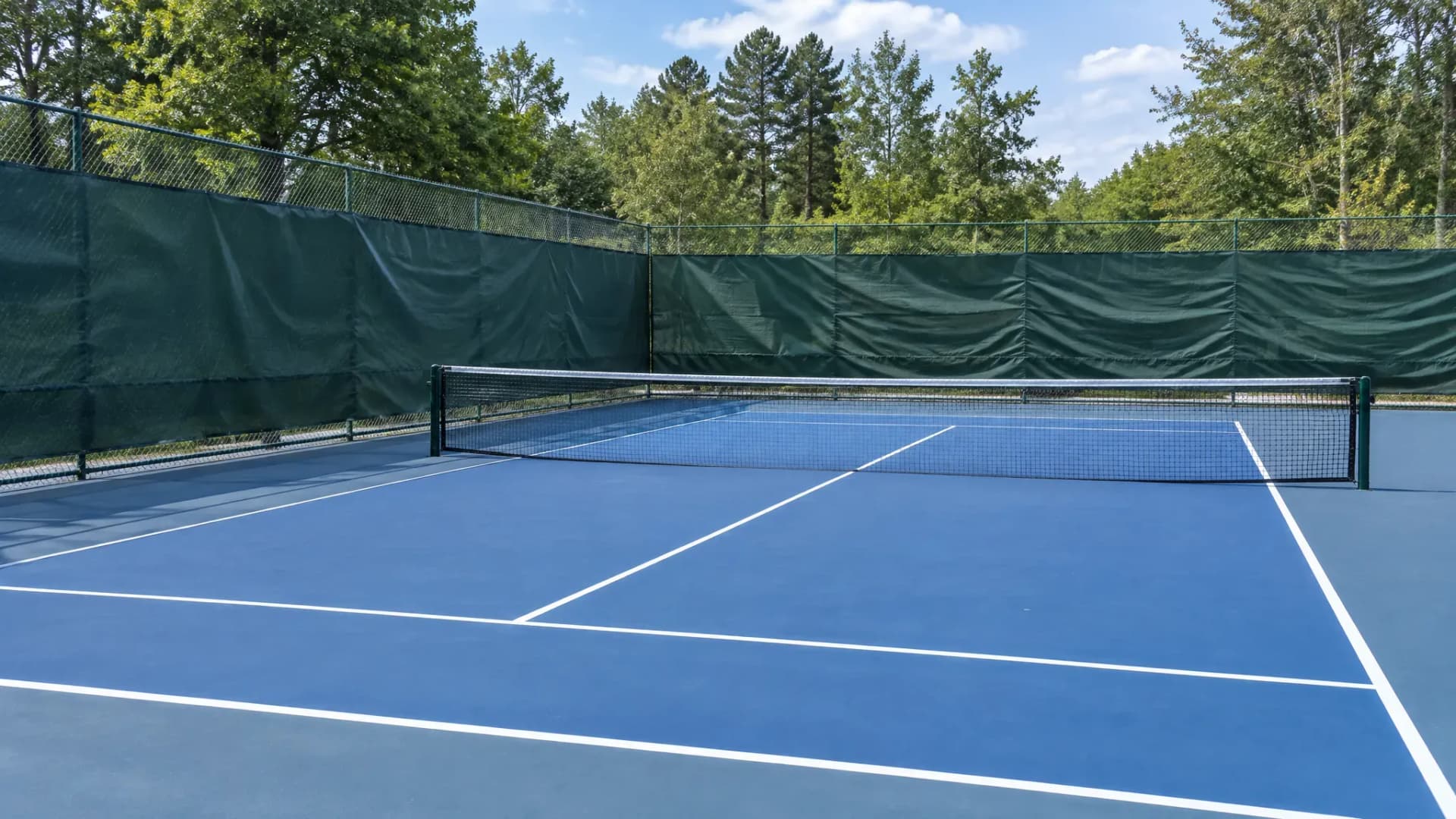 Court Windscreens: The Four Fabric Numbers to Demand Before You Order